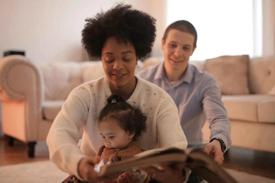 reading a book to their baby